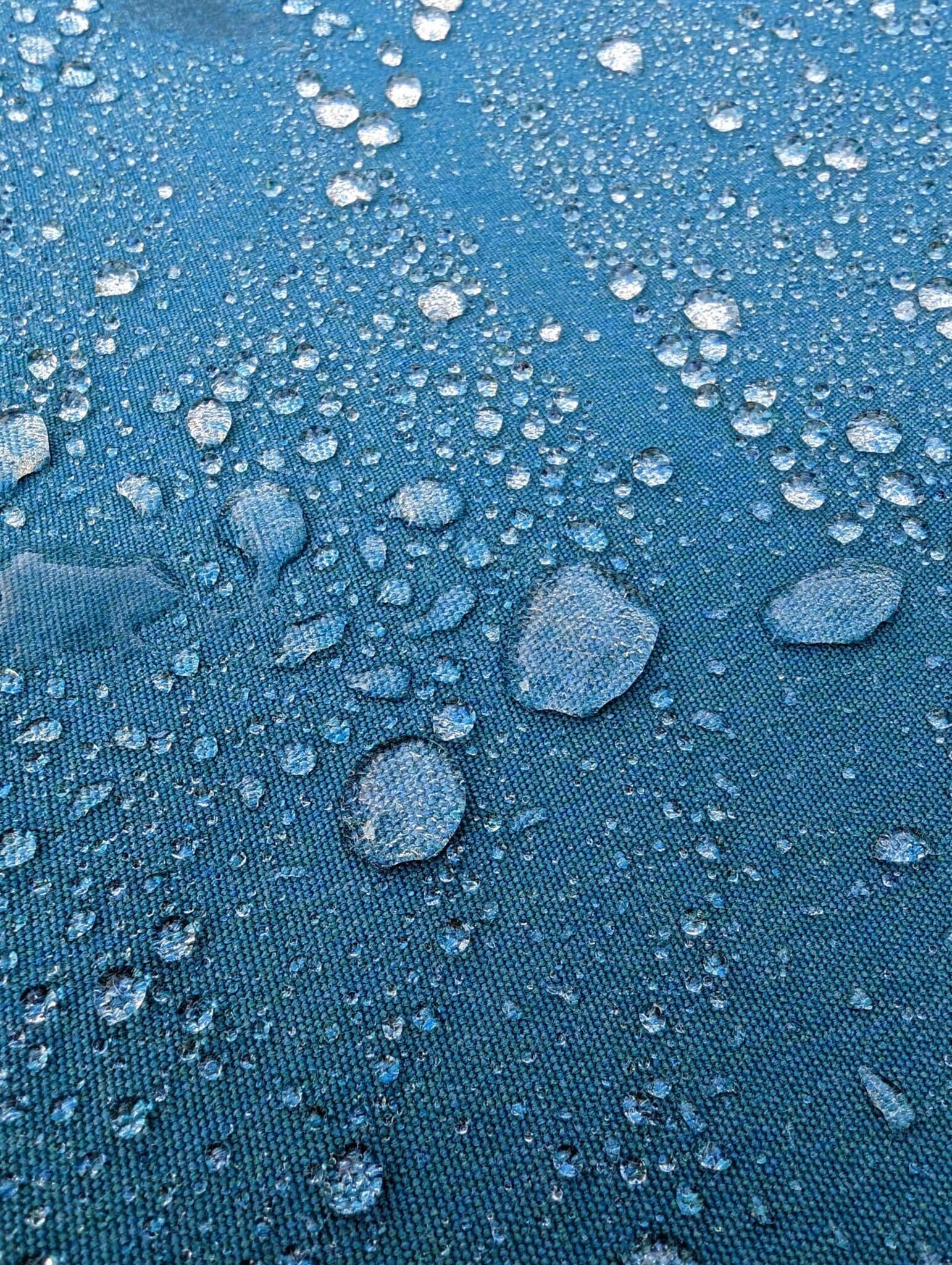 Water beading on blue marine-grade canvas